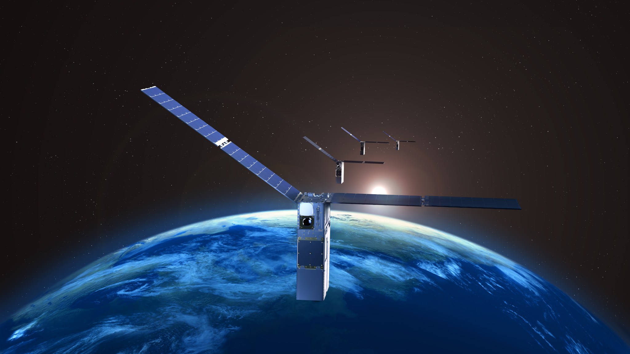 Illustrated image of four satellites orbiting Earth as the sun rises over the planet's horizon.