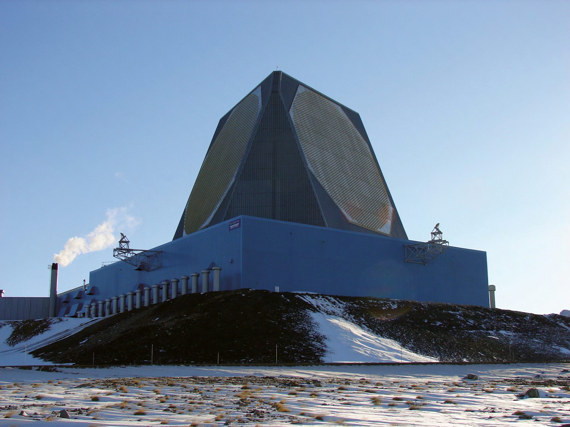 a large outdoor structure with angled sides containing octagonal patterns